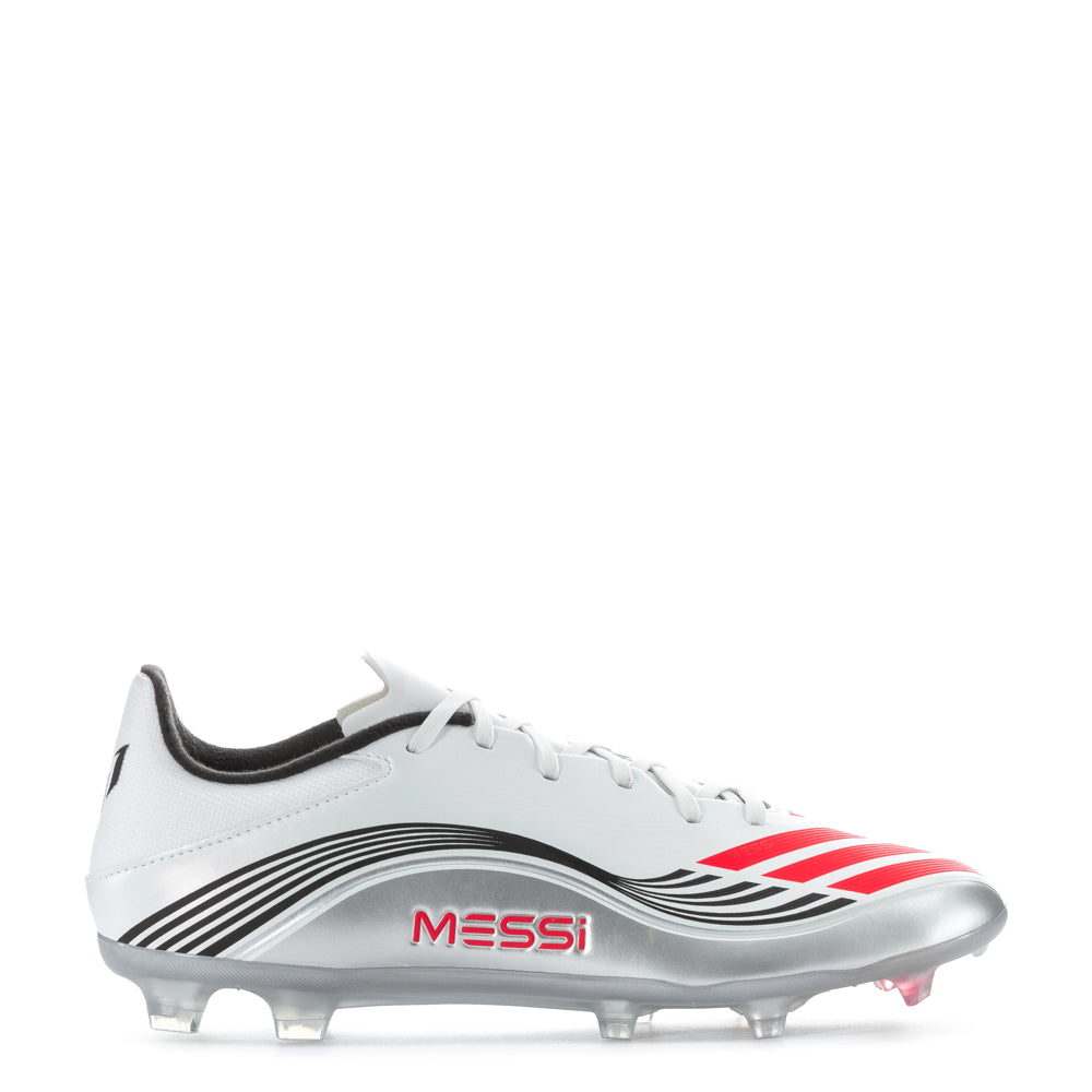 Adidas F50 League Low FG Messi men's soccer cleats on the field, showing textured exterior and stud configuration
