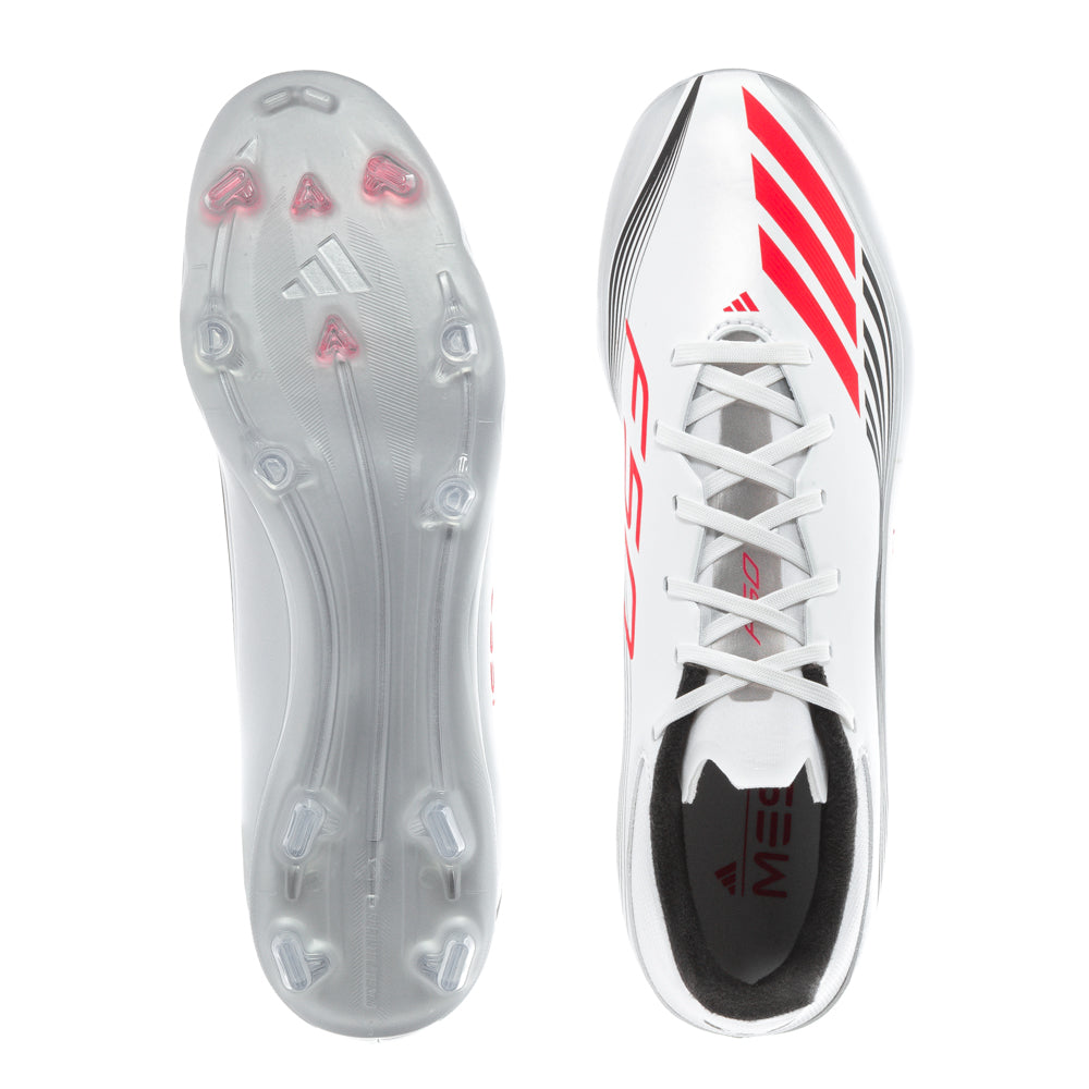Adidas F50 League Low FG Messi mens soccer cleats on the field, showing textured exterior and stud configuration