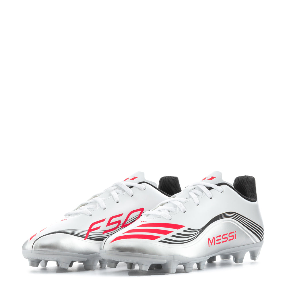 Action shot of a child wearing Messi F50 cleats while running on the soccer field.