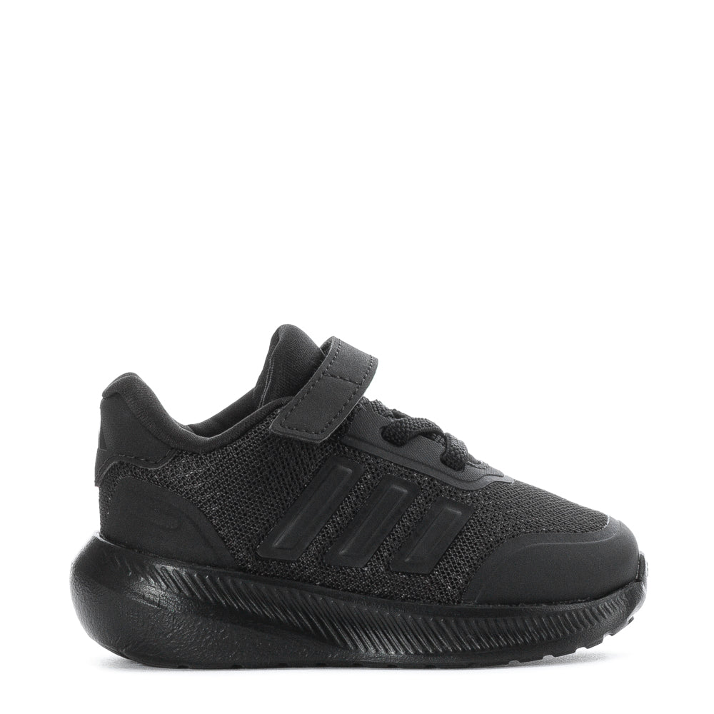 Toddler wearing X_PLR PATH kids sneakers on a sunny day