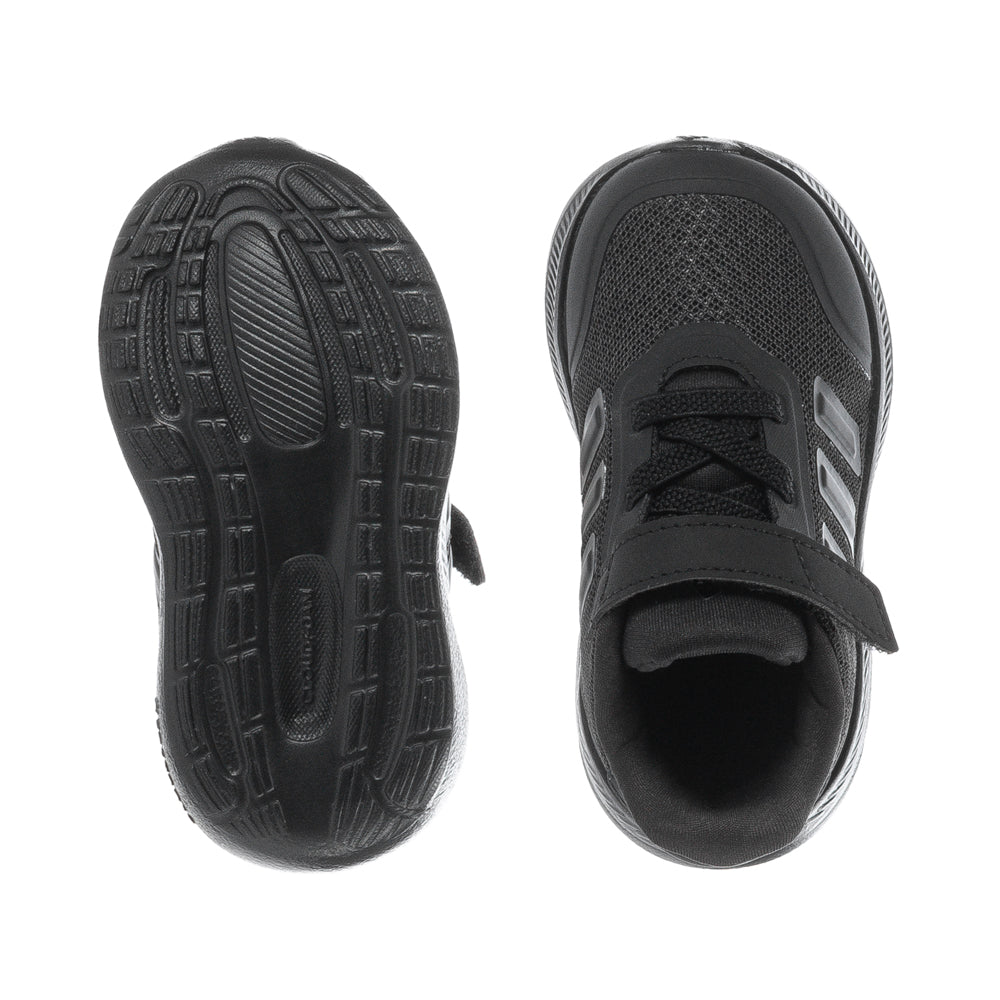 Toddler wearing X_PLR PATH kids sneakers on a sunny day