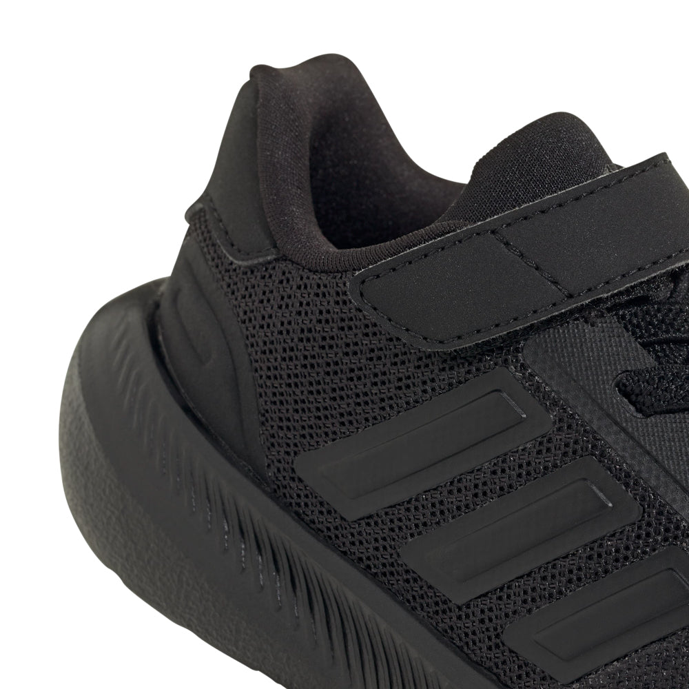 Young child walking confidently in stylish toddler sneakers