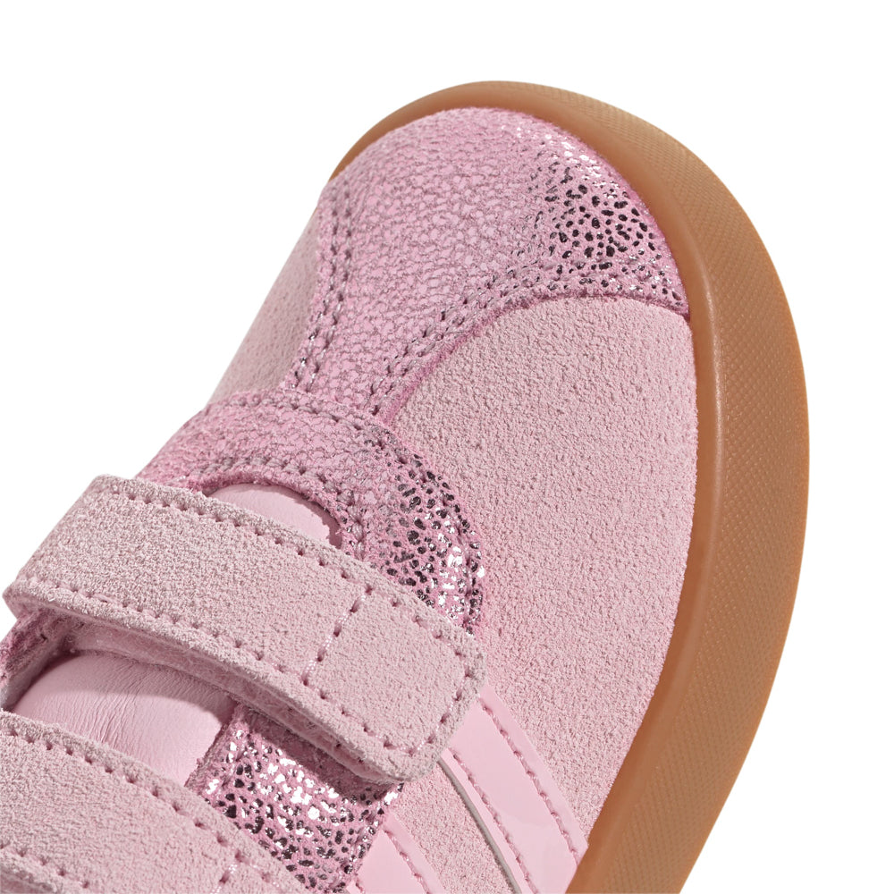 Close-up of the vulcanized sole and Velcro strap on Adidas toddler sneakers