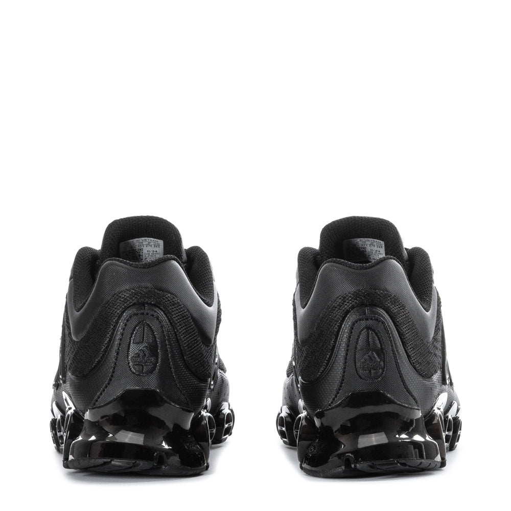 Side view of Megaride athletic shoes highlighting stylish design and mesh material