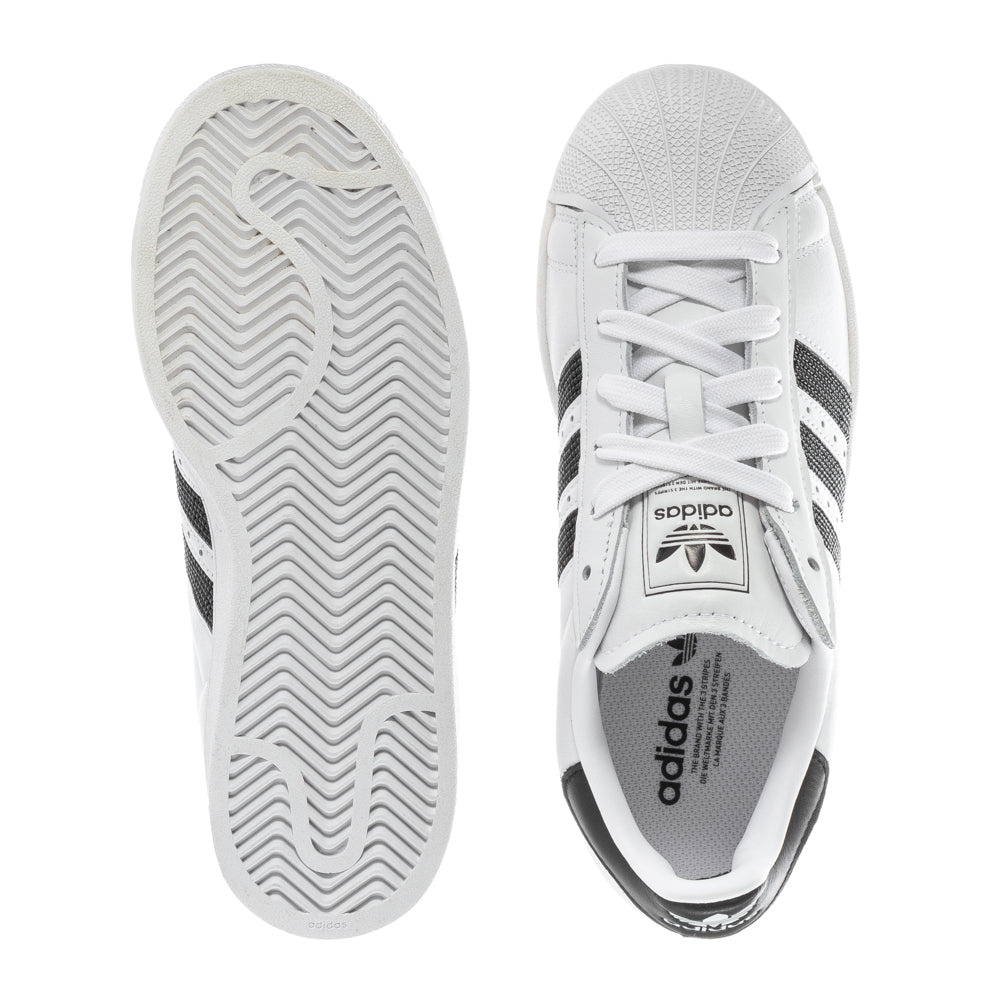 Adidas Superstar II womens sneakers featuring a classic rubber shell toe and stylish leather design from the side.