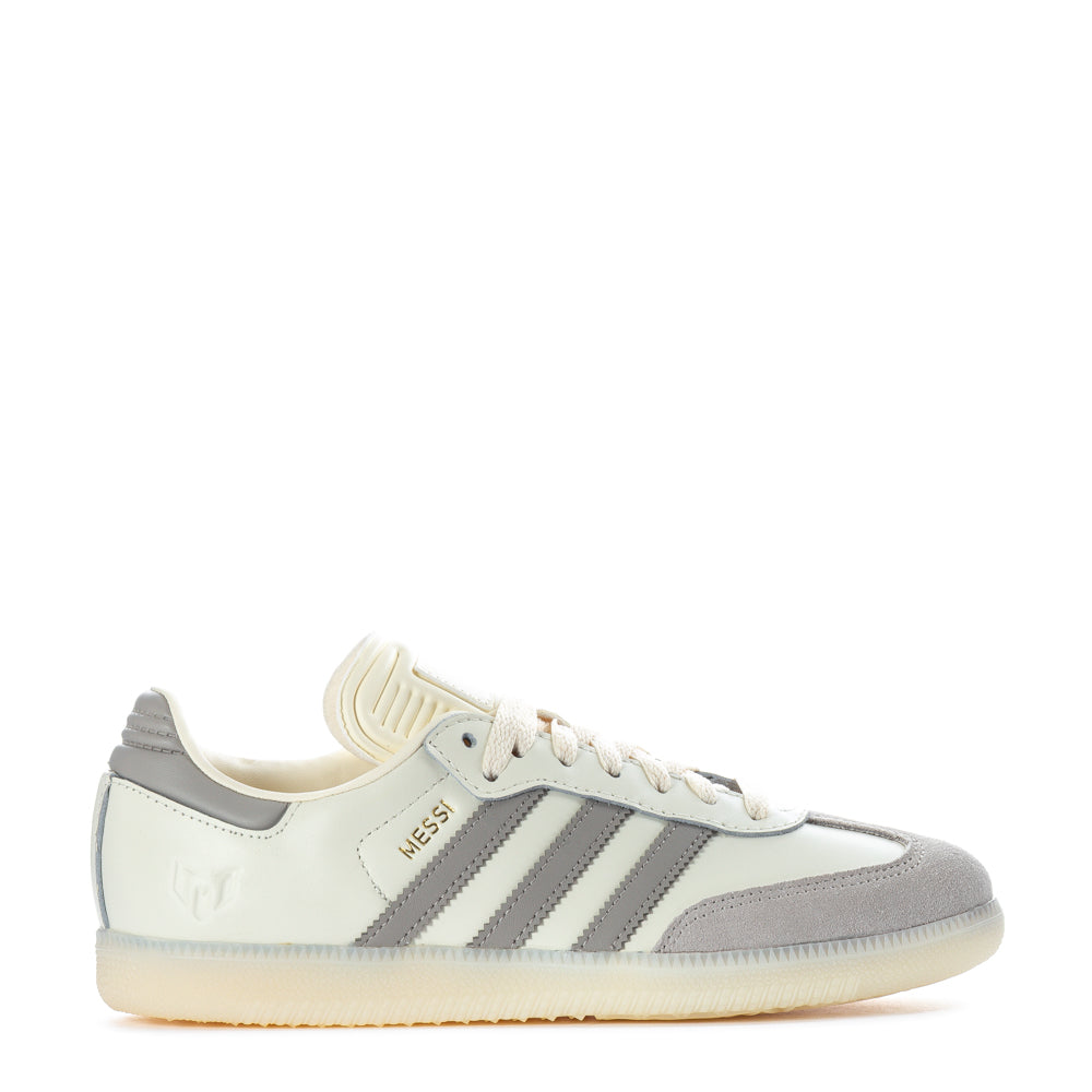 Three-quarter view of adidas Samba youth sneakers showing leather upper and classic gum sole