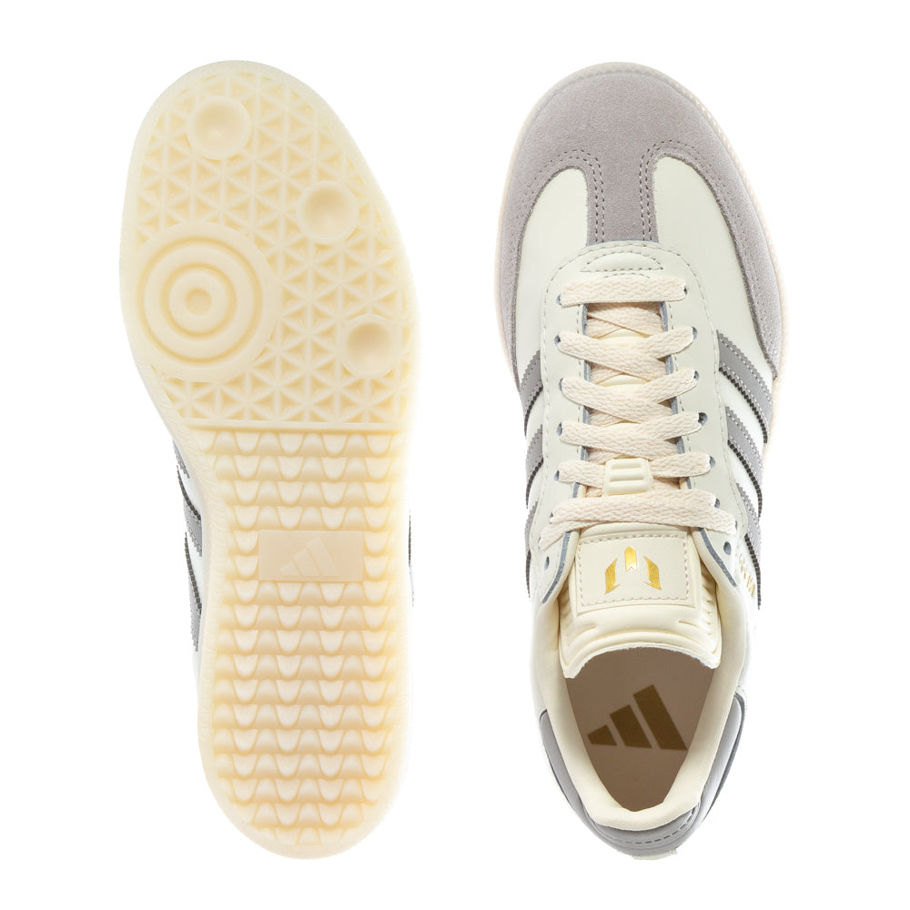Three-quarter view of adidas Samba youth sneakers showing leather upper and classic gum sole