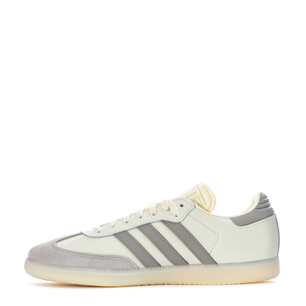 Side view of Adidas Samba OG shoes on a city street, perfect for everyday casual wear