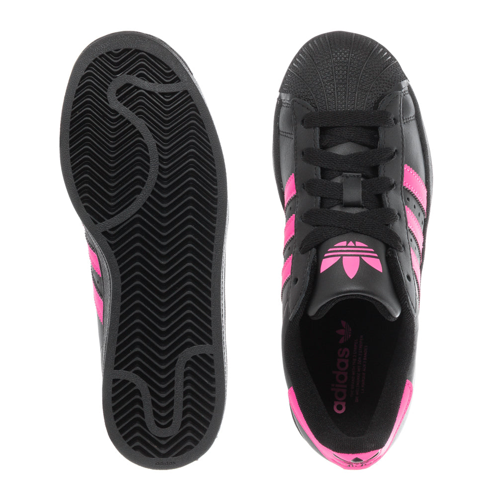 Side view of Adidas Superstar Youth Sneakers in monochrome design, perfect for stylish youth.