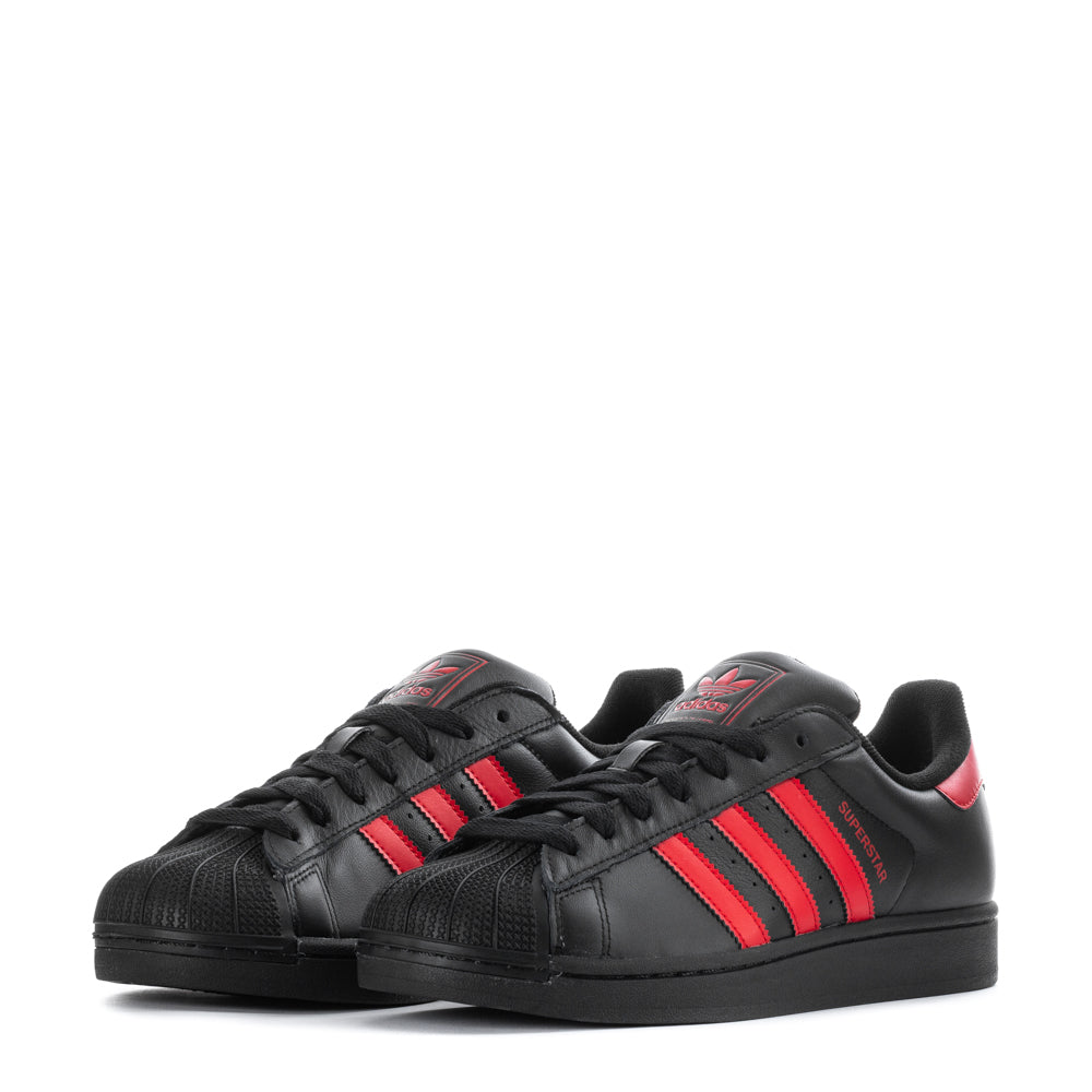 Close-up of the iconic 3-Stripes on adidas Superstar II mens leather sneakers in a bold colorway.