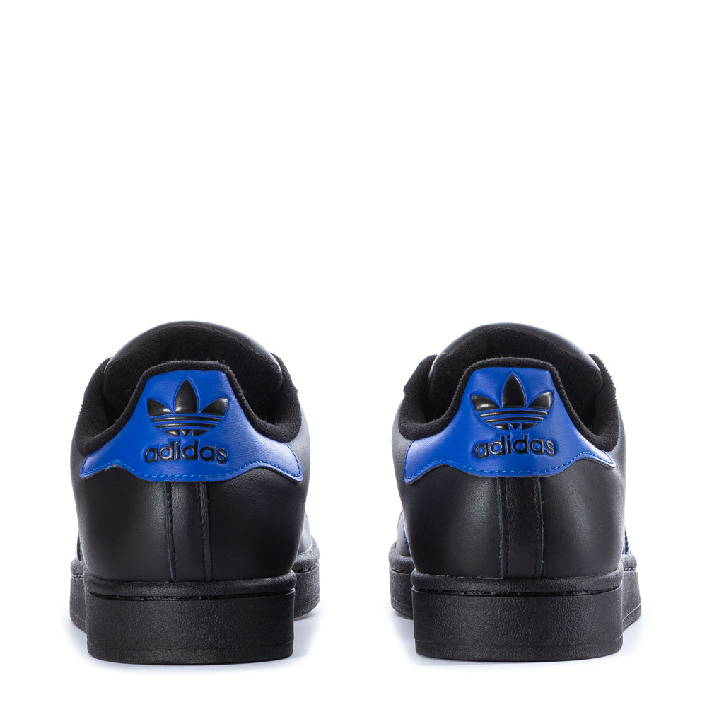 Side view of adidas superstar casual sneakers highlighting padded collar and leather upper
