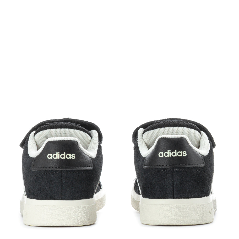 Child wearing stylish kids sneakers during outdoor play