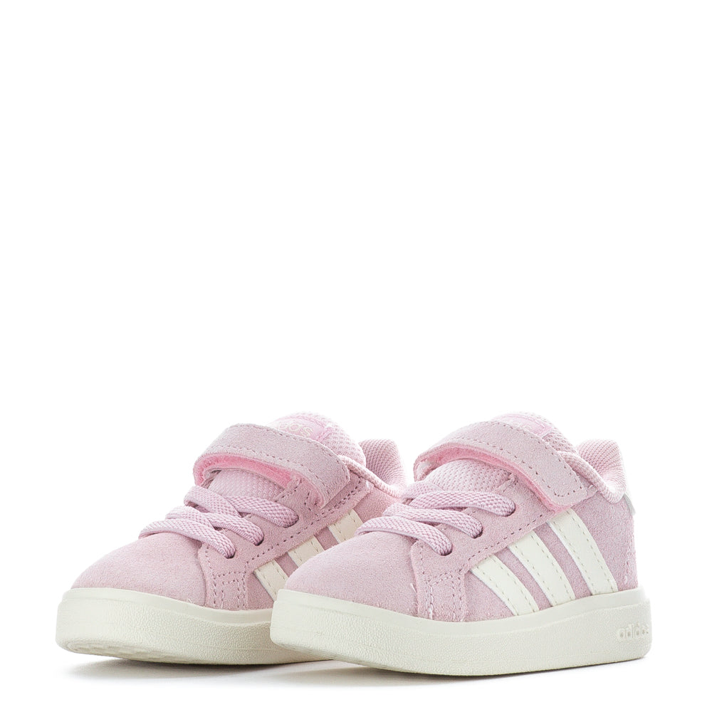 Young child happily walking in comfortable toddlers shoes
