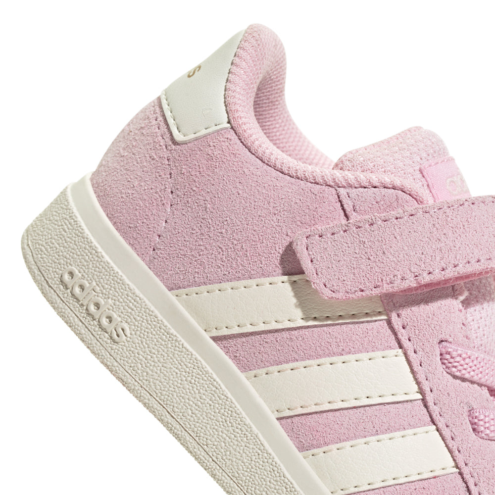 Toddler wearing supportive baby sneakers for walking outdoors