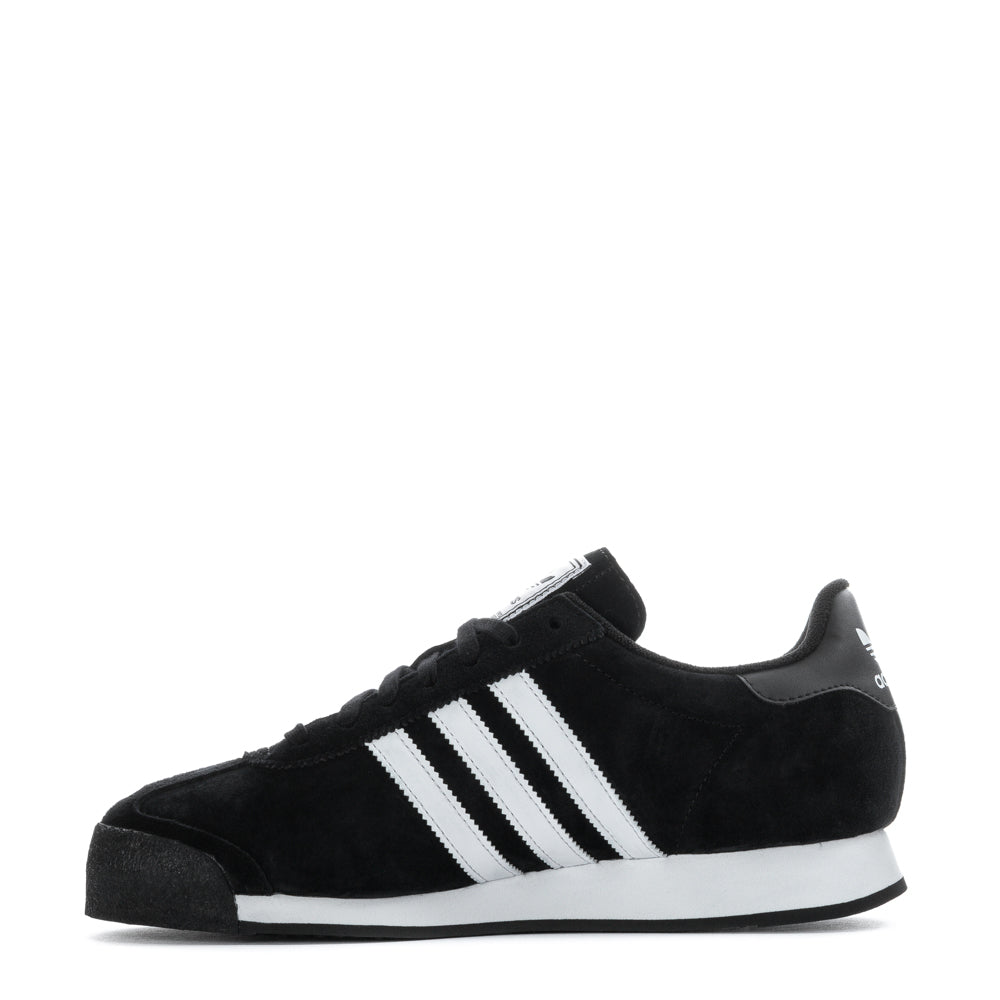Casual outdoor scene featuring Adidas Samoa sneakers on a mans feet