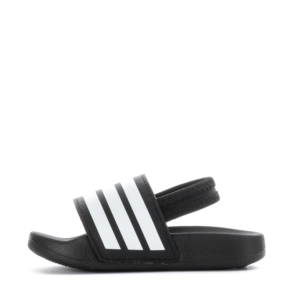Toddler walking in Adidas slides, highlighting comfort and style