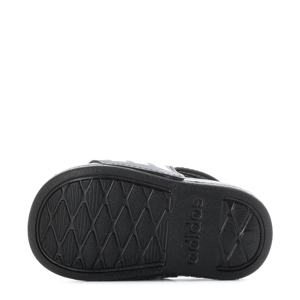 Toddler walking in Adidas slides, highlighting comfort and style