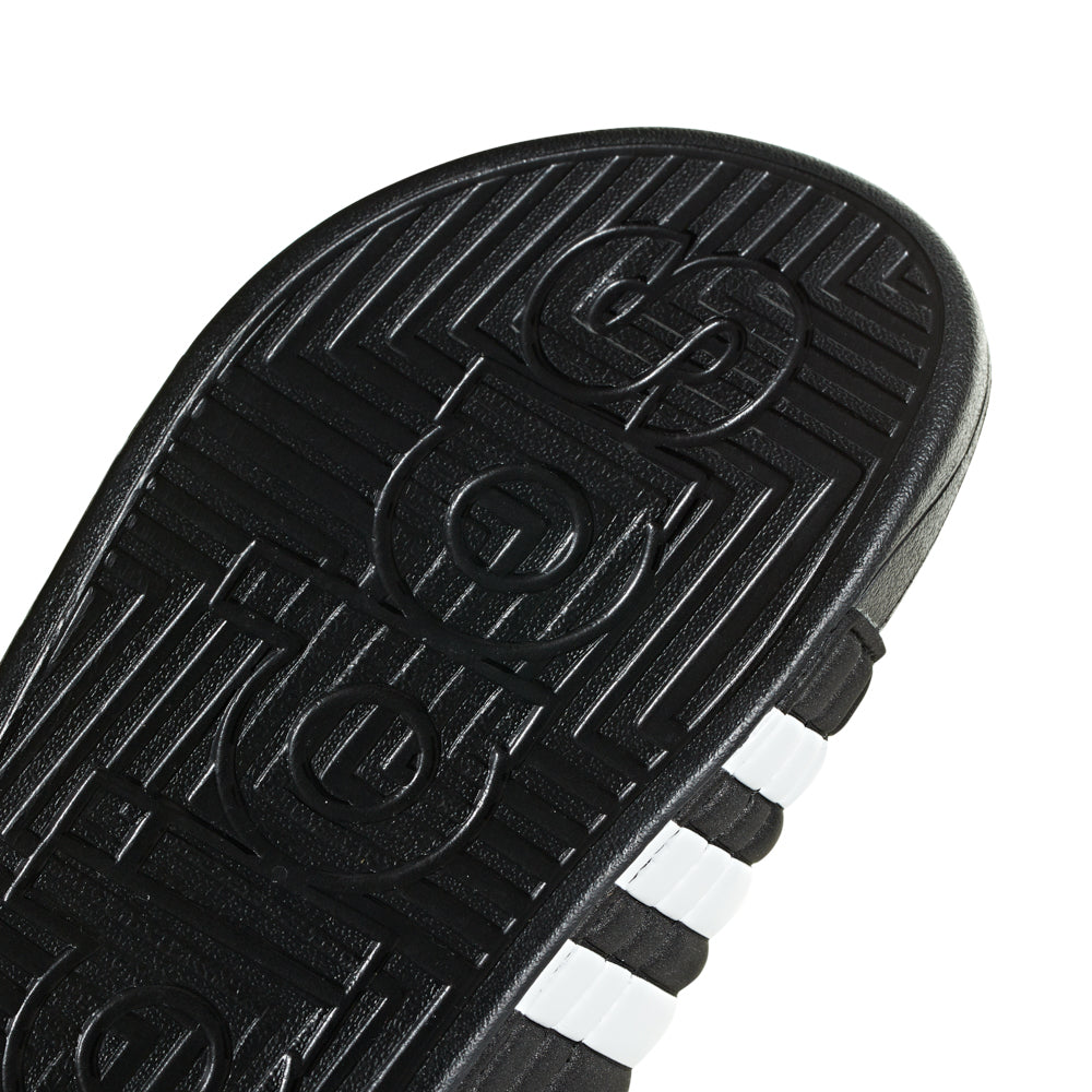 Toddler walking in Adidas slides, highlighting comfort and style