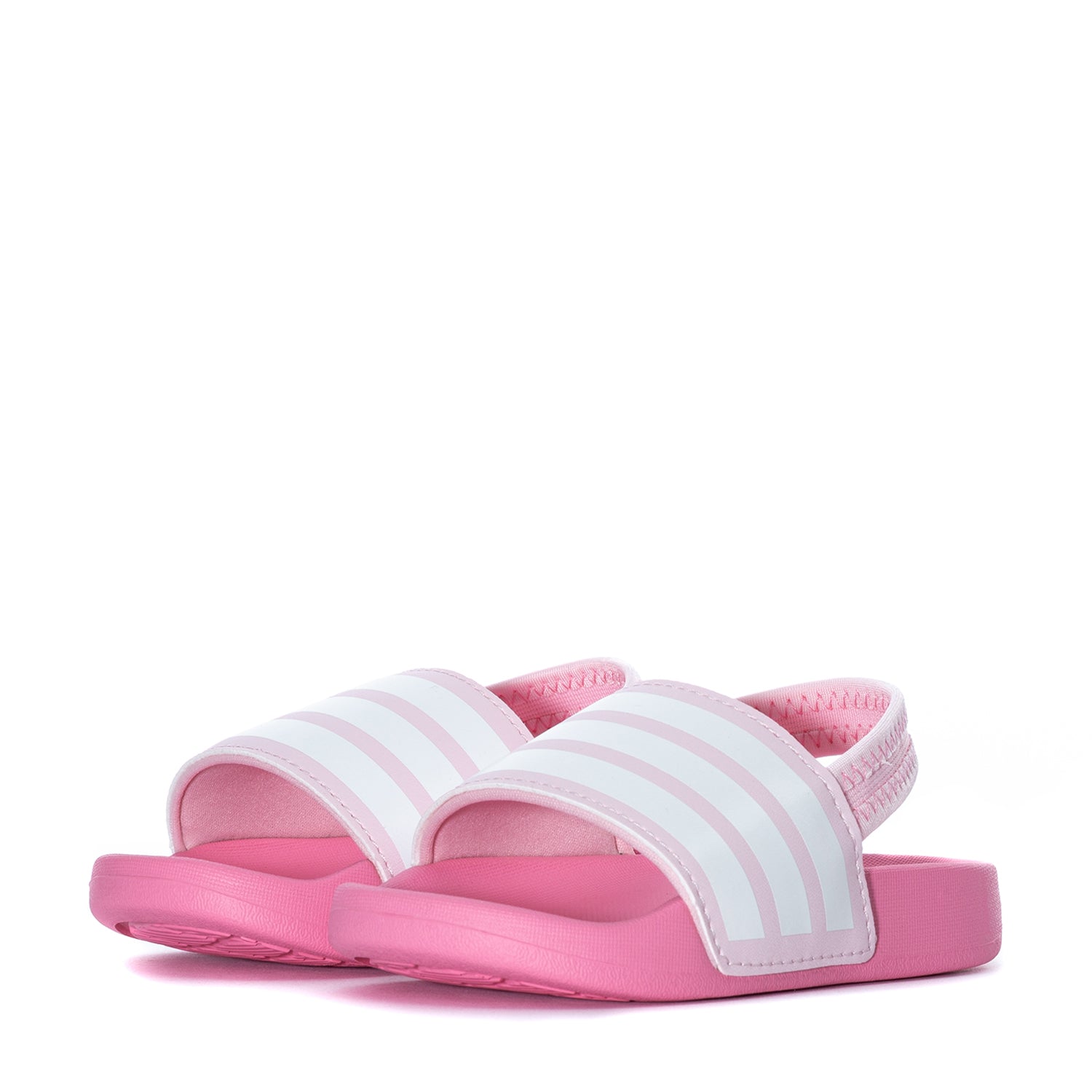 Child happily wearing slip-on toddler sneakers outdoors