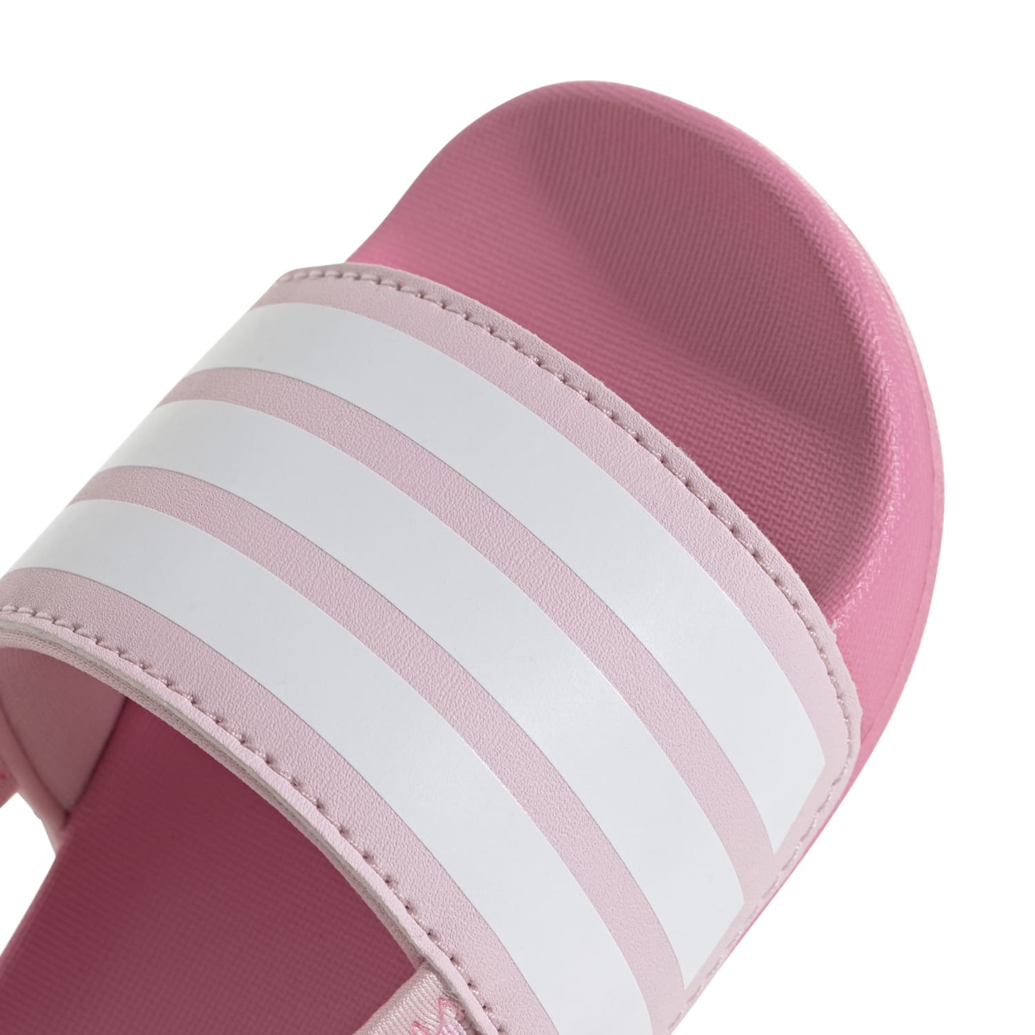 Child happily wearing slip-on toddler sneakers outdoors