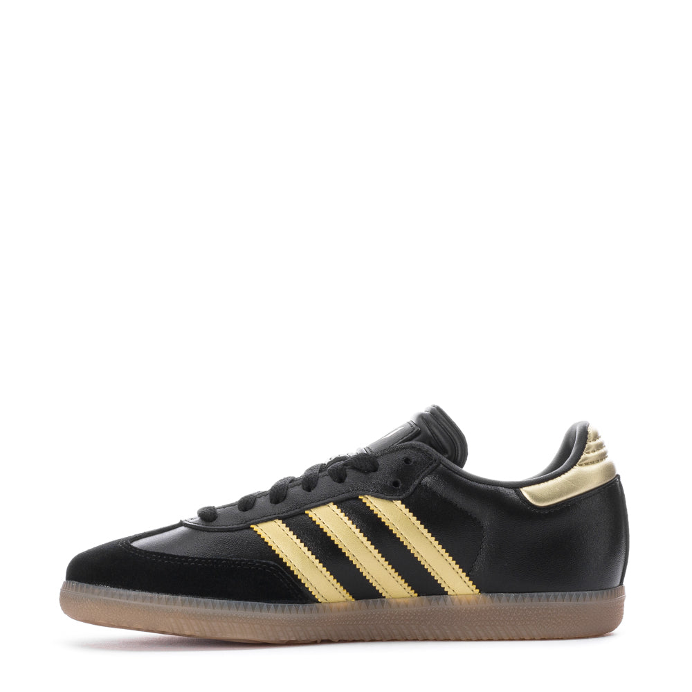 Close-up of the Adidas Samba OG kids sneakers, highlighting the leather upper and gum rubber sole.