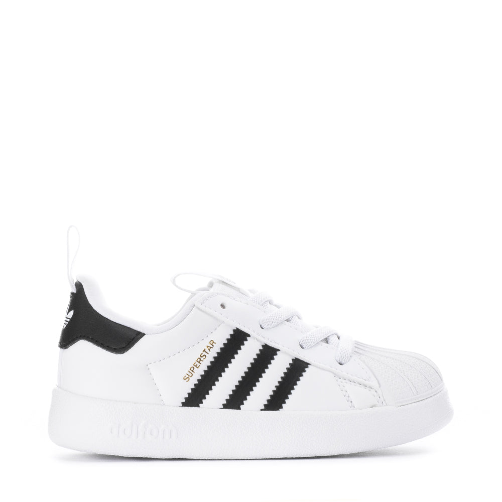 Side-angle view of LittleStride 360 leather toddler shoes showing padded collar and breathable mesh lining