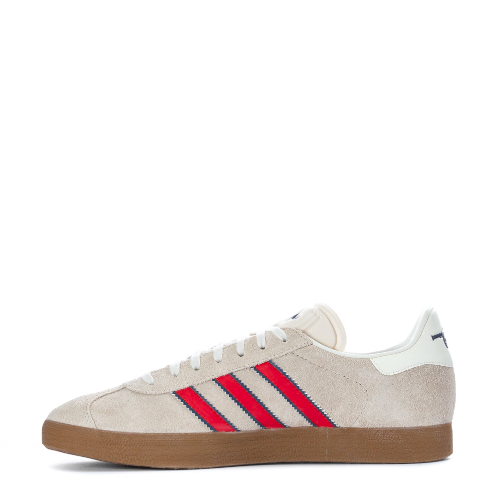 Side view of Adidas Gazelle mens sneakers, highlighting the lace closure and low-profile design.