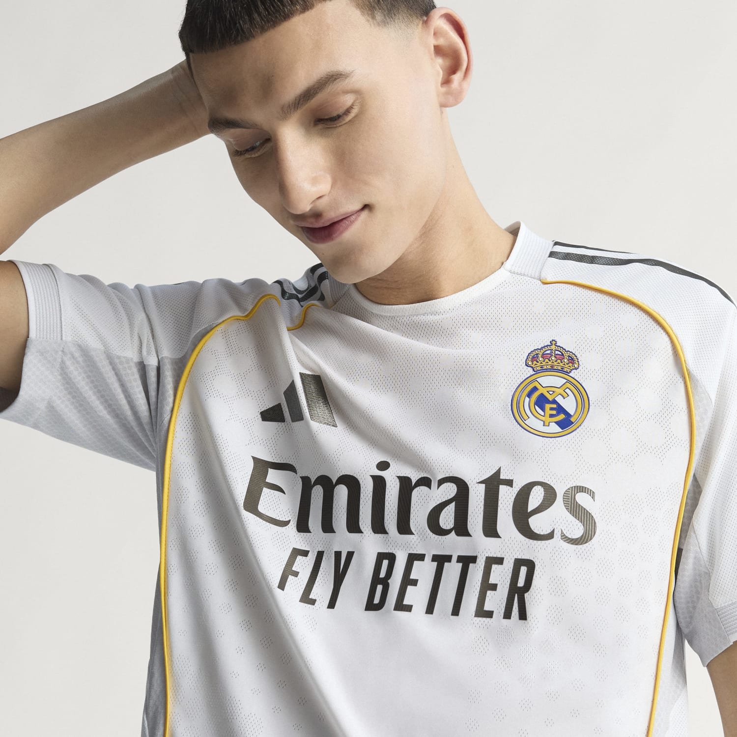 Front view of the 2025 Real Madrid authentic home jersey showcasing the team logo.