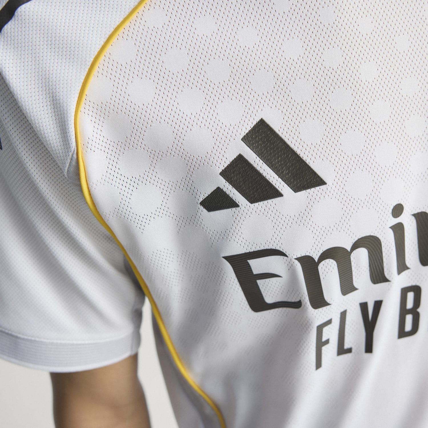 Side view of the Real Madrid jersey, highlighting the breathable fabric and fit.