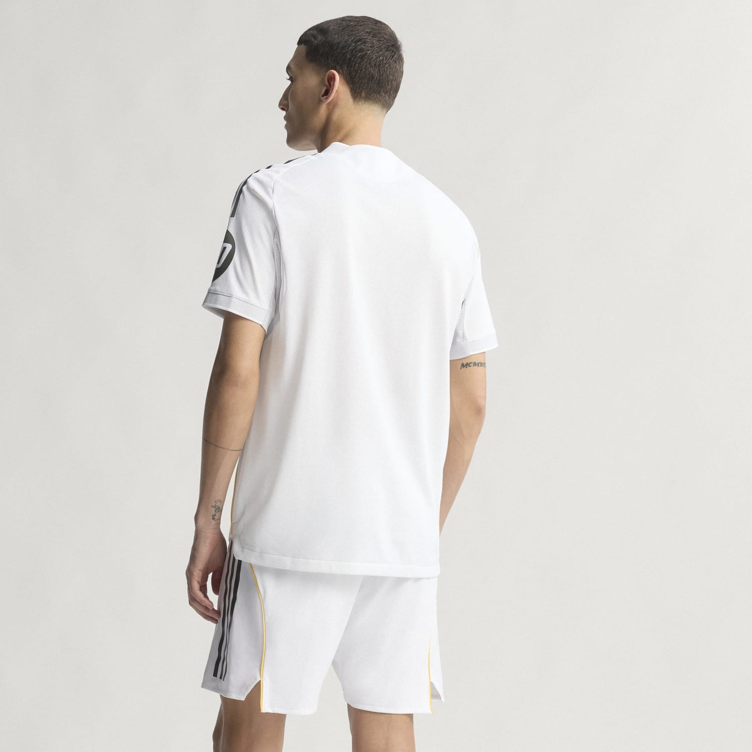Side view of the Real Madrid jersey, highlighting the breathable fabric and fit.