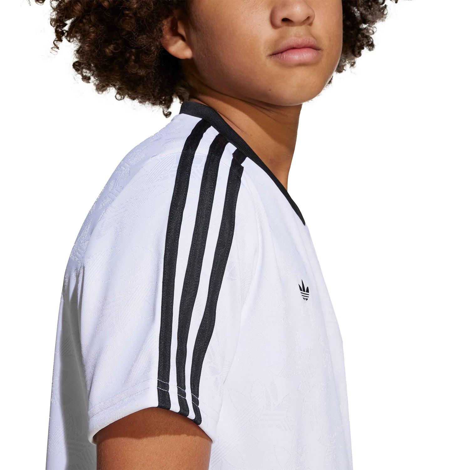 Close-up of the graphic design on a youth sport tee, showcasing vibrant colors.