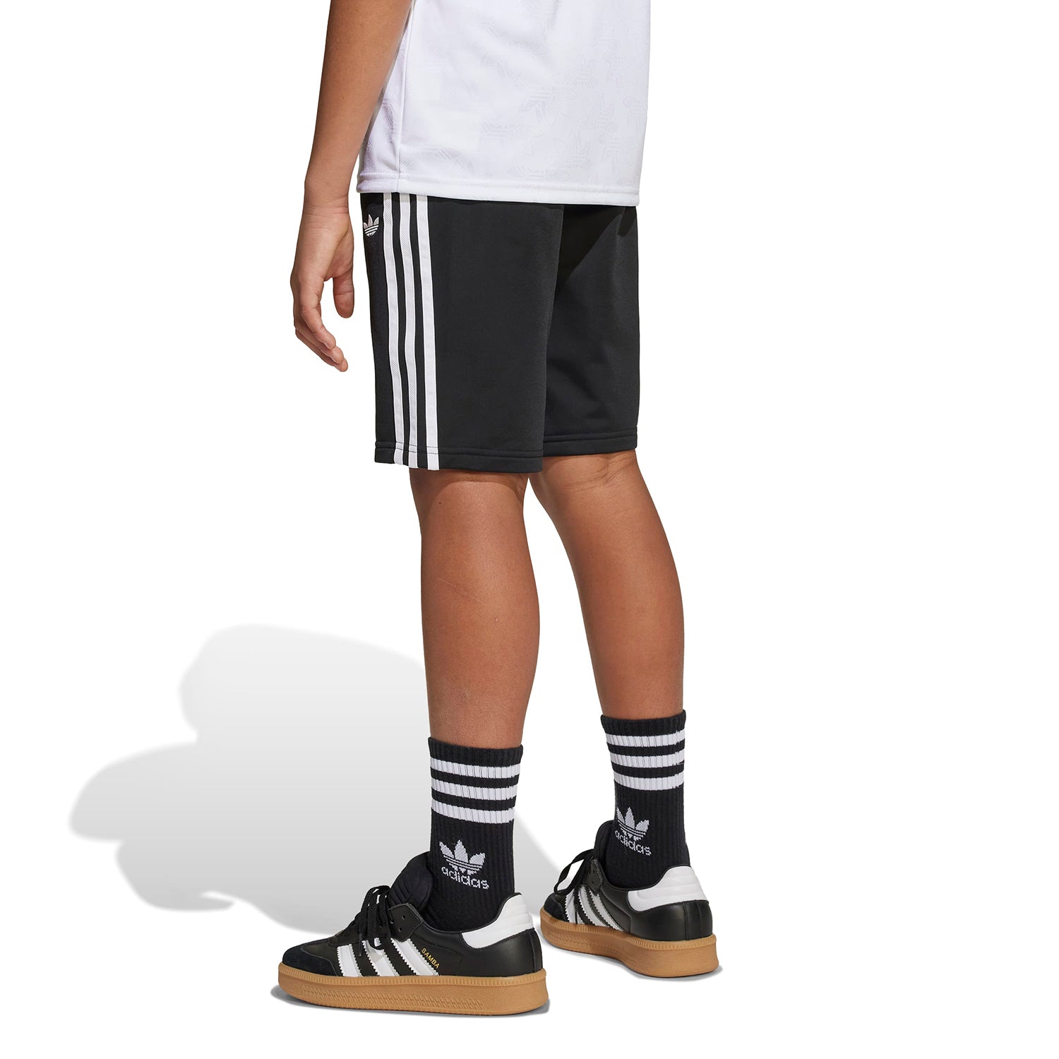 Kids running in athletic shorts on track