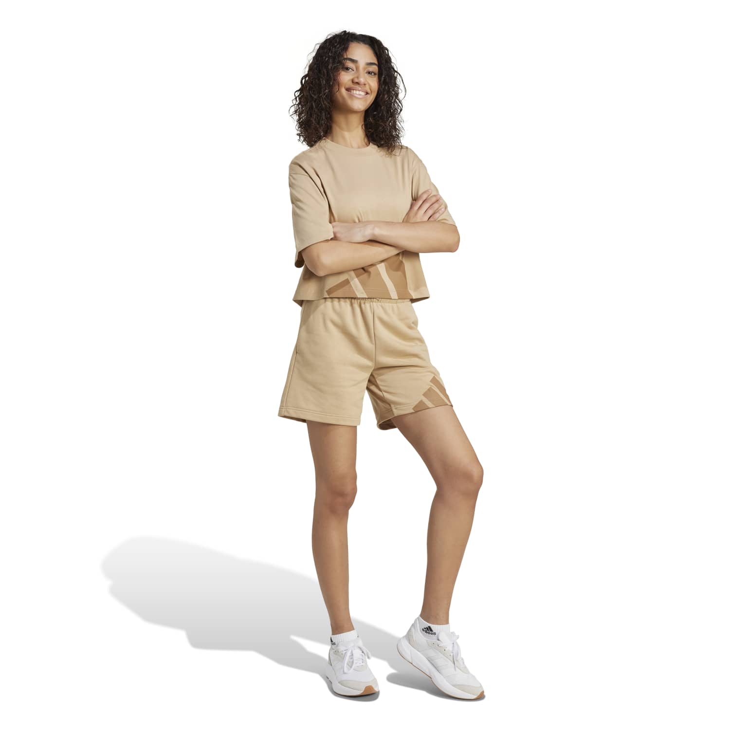 Front view of the women’s logo tee on a casual streetwear look