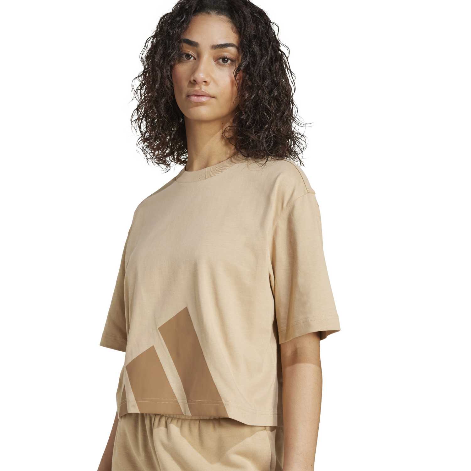 Close-up of the oversized women’s t shirt with logo detail, perfect for streetwear outfits