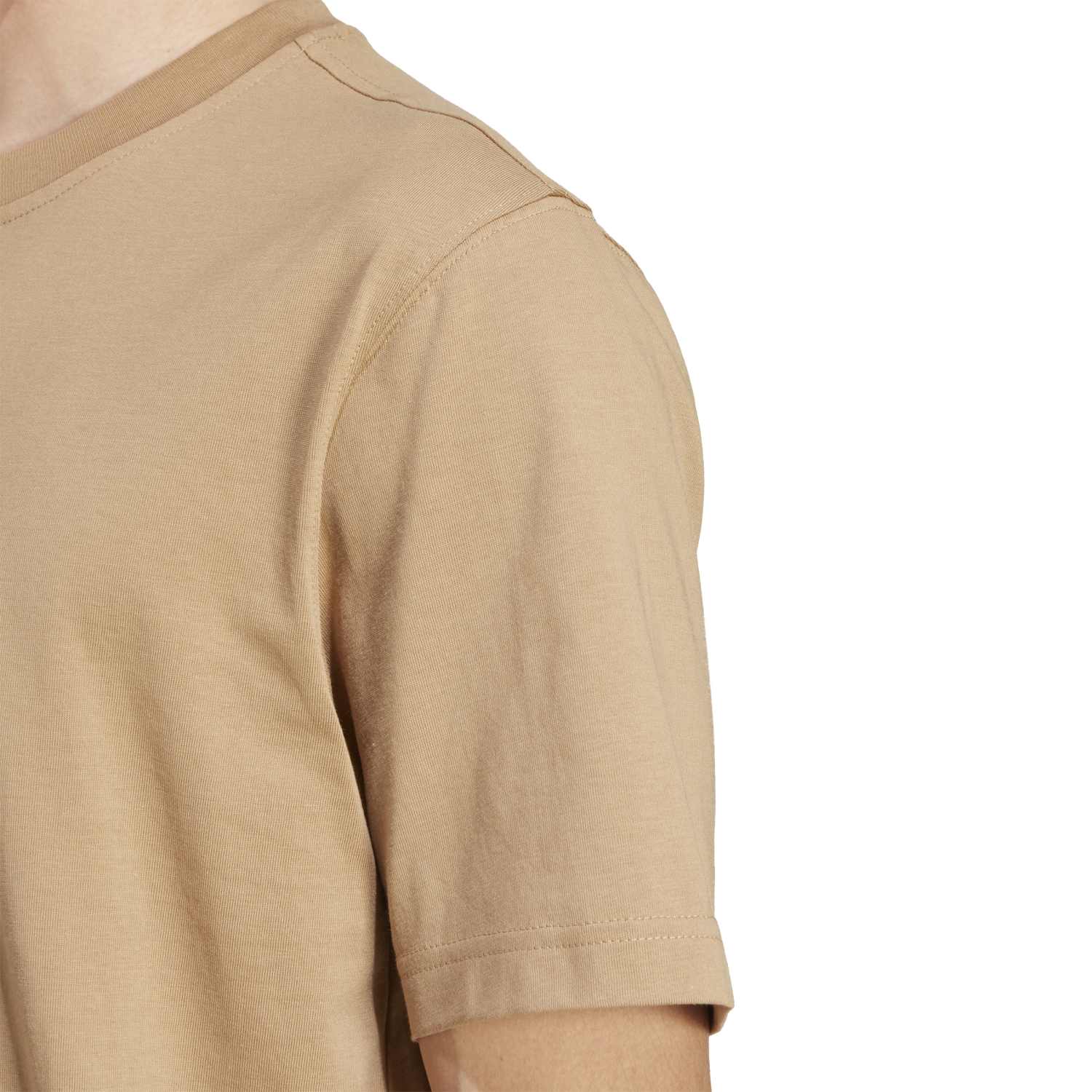 Side view of the Adidas tee, demonstrating its classic fit and ribbed crewneck.