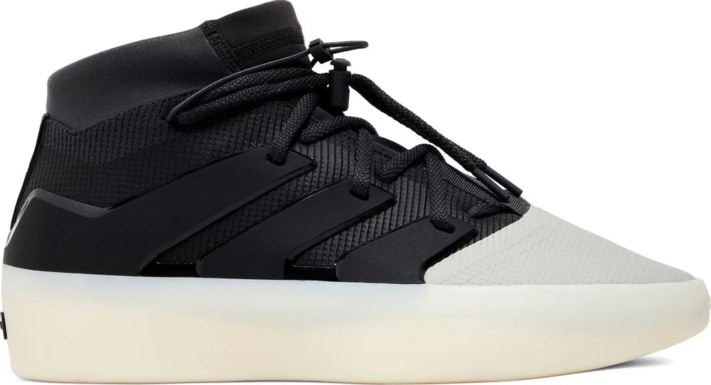 Front view of Adidas Fear of God Carbon Sesame sneakers highlighting the unique colorway