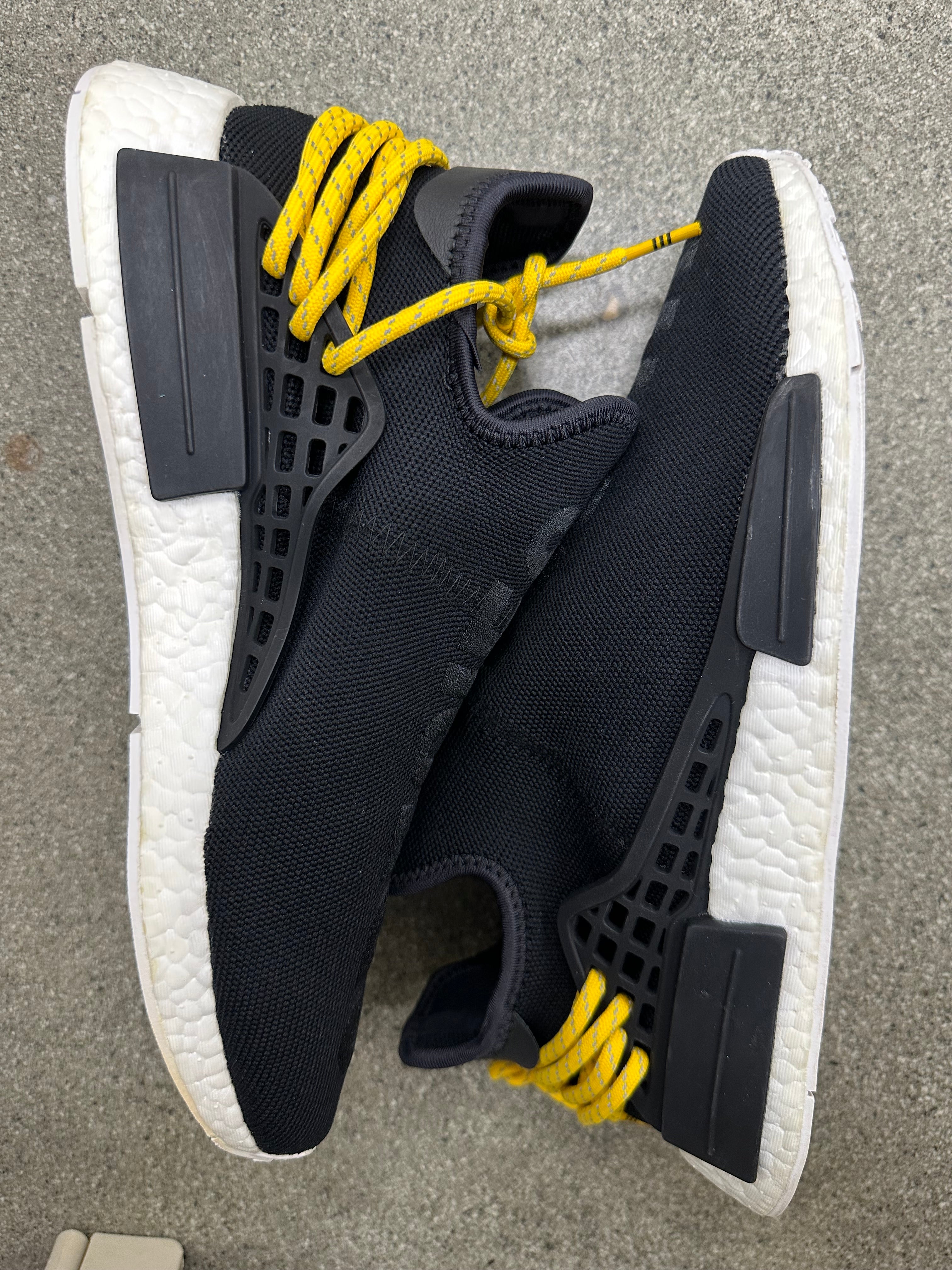 Top view of adidas NMD black shoes highlighting the comfortable insoles and sleek style