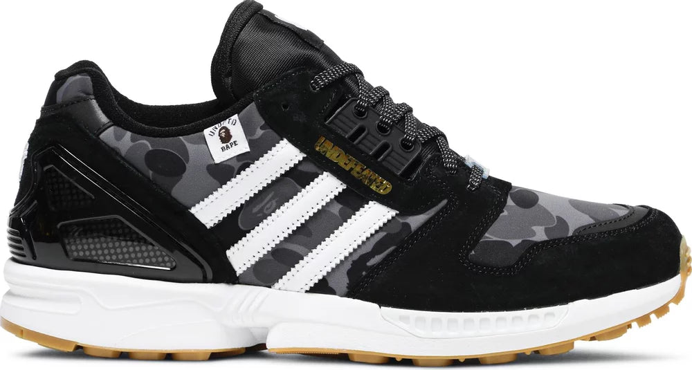 Side view of Adidas ZX 8000 BAPE UNDEFEATED Black Edition highlighting its stylish silhouette.