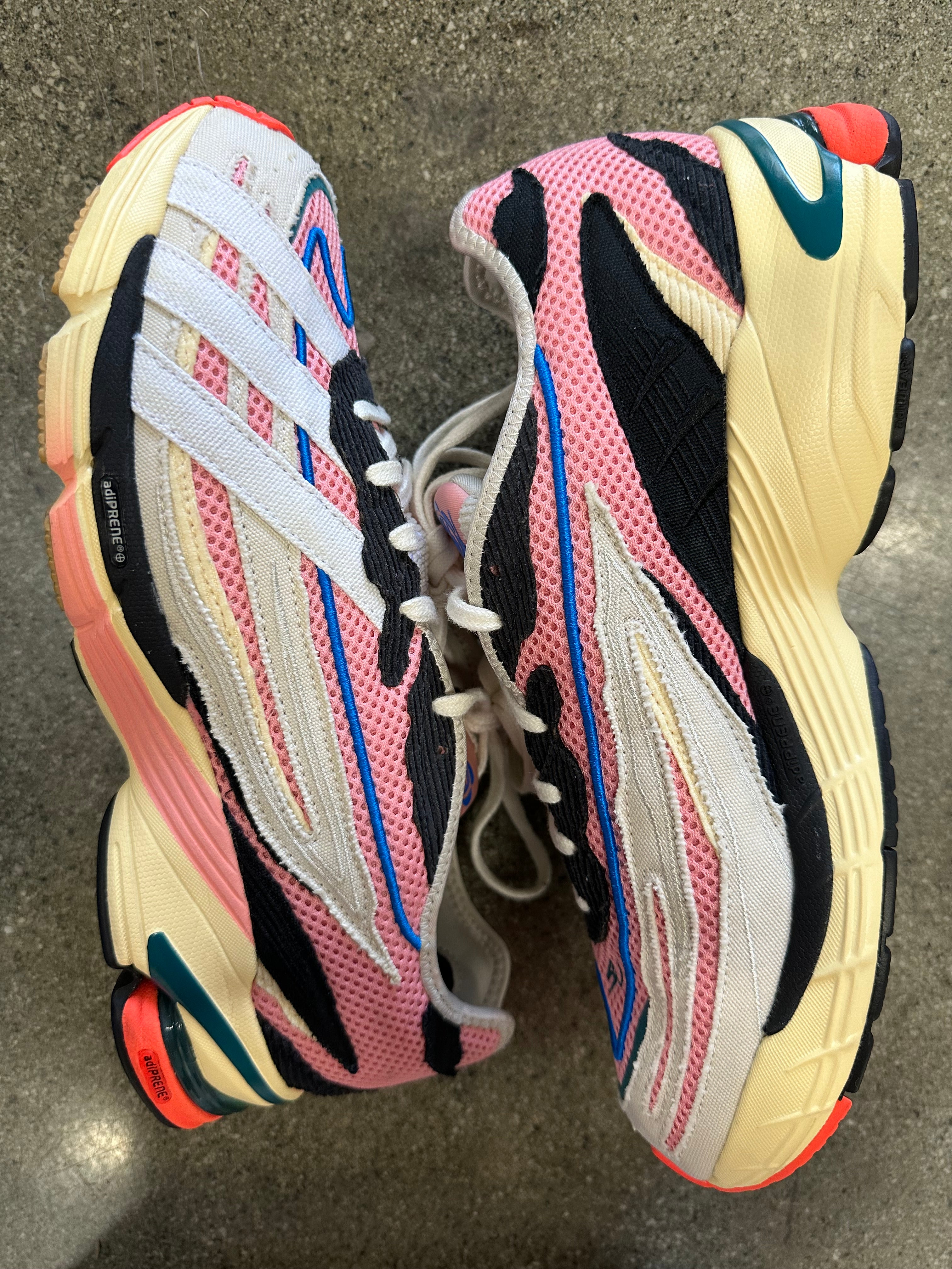Side view of Adidas Orketro sneakers size 10, showing the classic design.