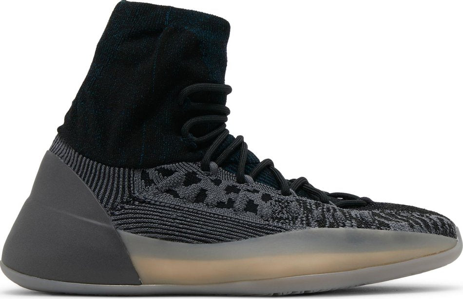 Side view of Adidas Yeezy BSKTBL sneakers in slate blue, highlighting the unique design and texture.