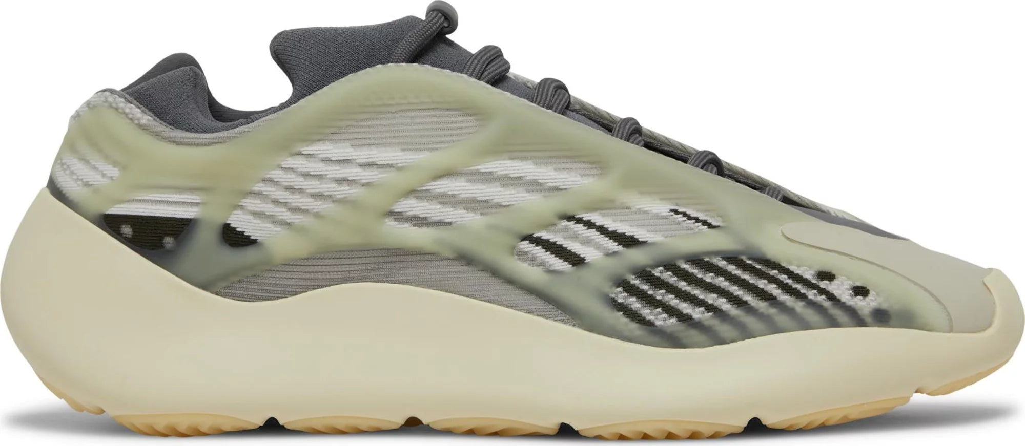 Adidas Yeezy Boost 700 V3 Faded Salt sneakers from the side, highlighting their sleek silhouette.