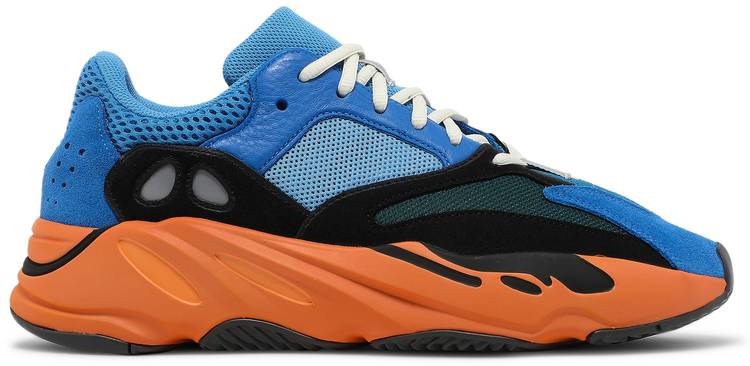 Side view of Yeezy Boost 700 Bright Blue sneakers highlighting the vibrant color.