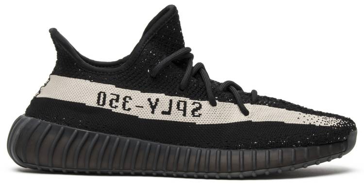 Close-up view of Adidas Yeezy Boost 350 V2 Oreo sneakers highlighting the black knit and white stripe.