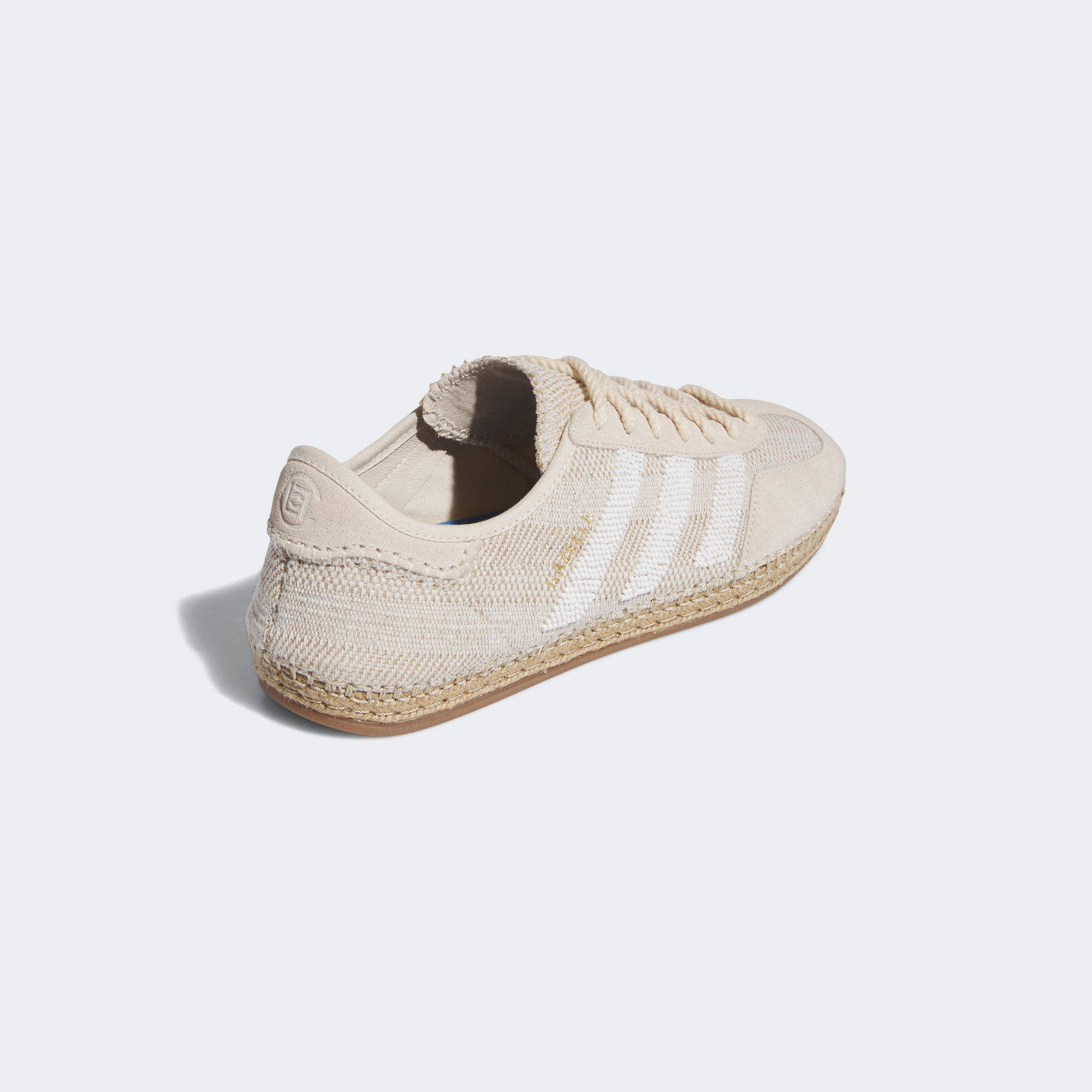 Close-up of the textured outsole and suede upper of Adidas CLOT Gazelle Halo Ivory sneakers