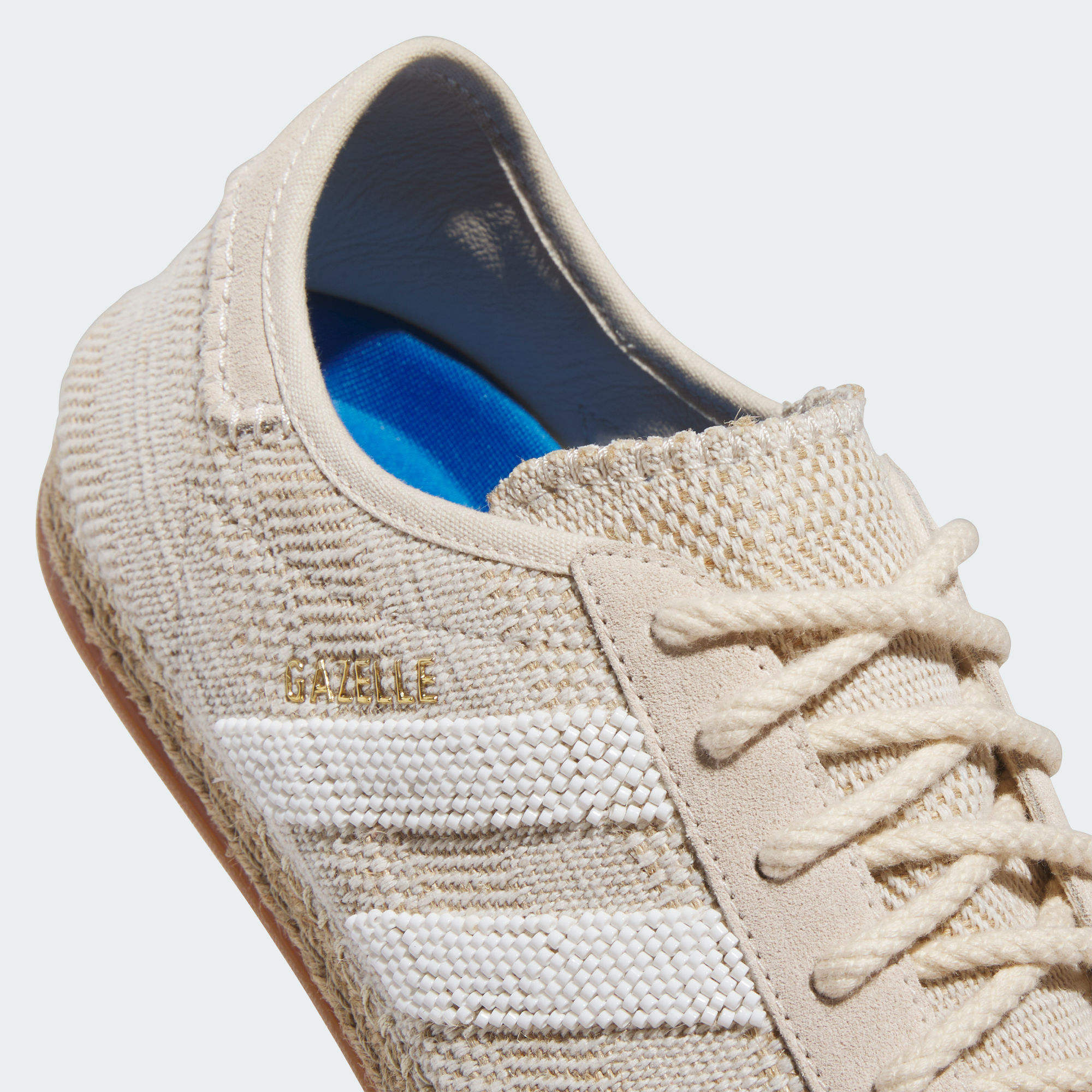 Close-up of the textured outsole and suede upper of Adidas CLOT Gazelle Halo Ivory sneakers