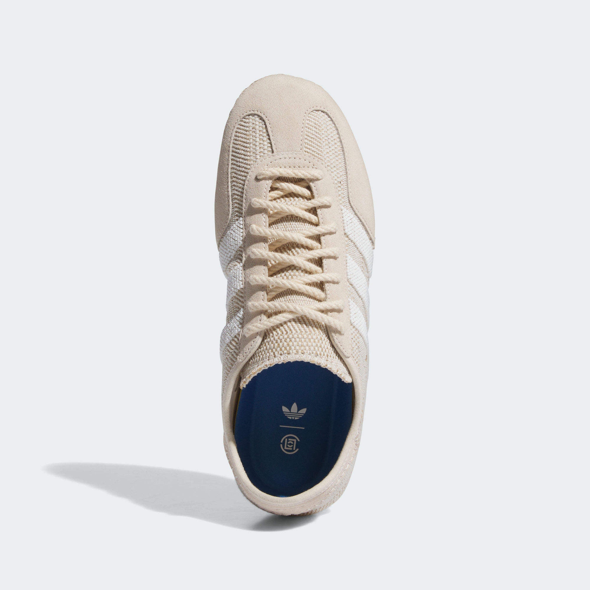 Close-up of the textured outsole and suede upper of Adidas CLOT Gazelle Halo Ivory sneakers