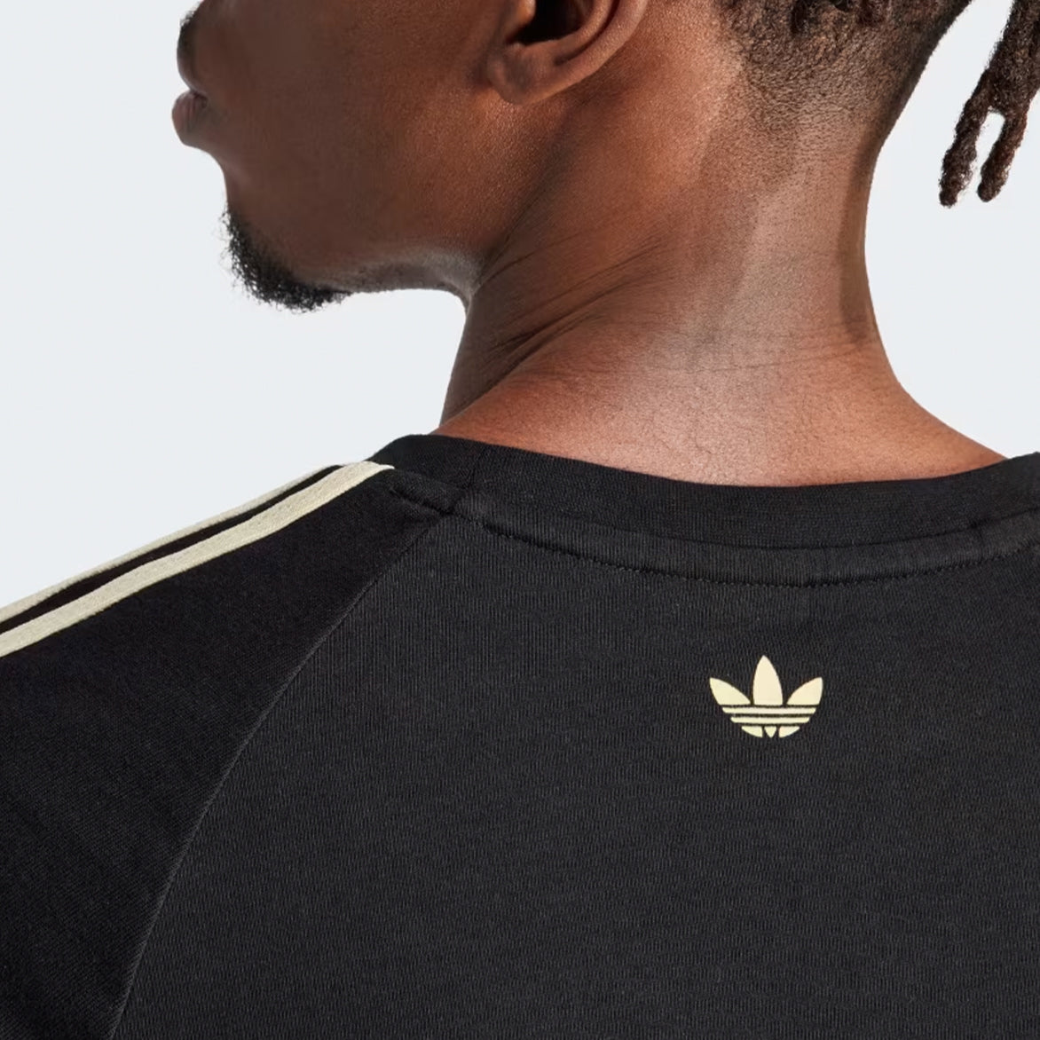Wales Bonner x Adidas limited edition black tee featuring a ribbed collar and the Wales Bonner wordmark on the chest.