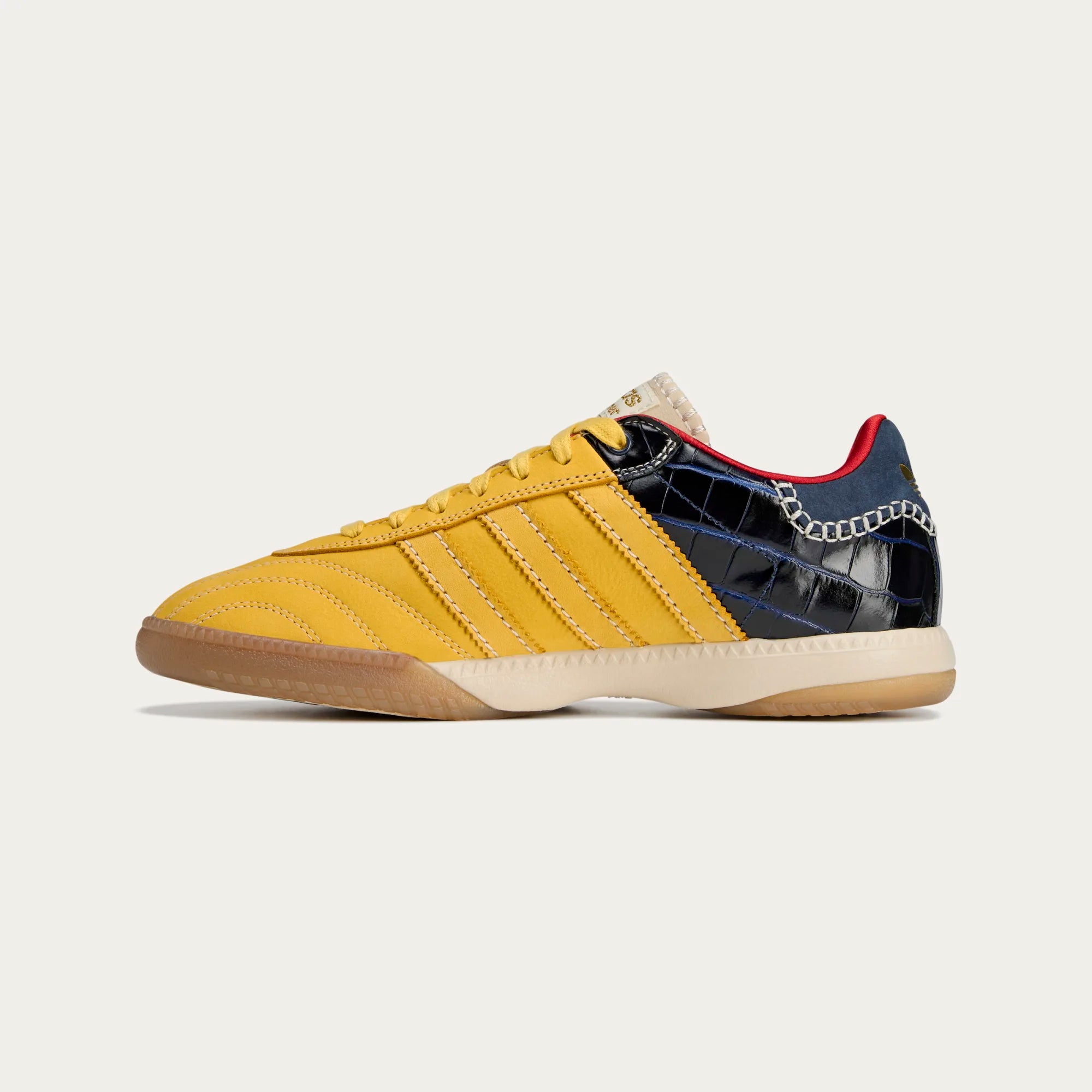 Side view of the limited edition Wales Bonner and adidas sneakers on streetwear style