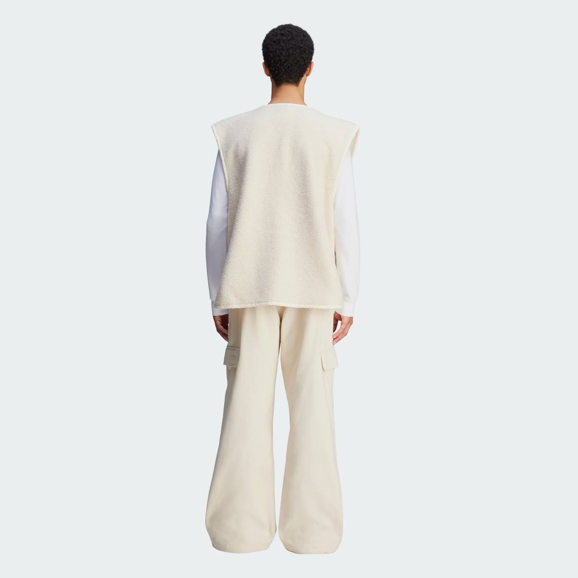 Side view of Wales Bonner x Adidas cargo pants showcasing cargo pockets and snap button closure.