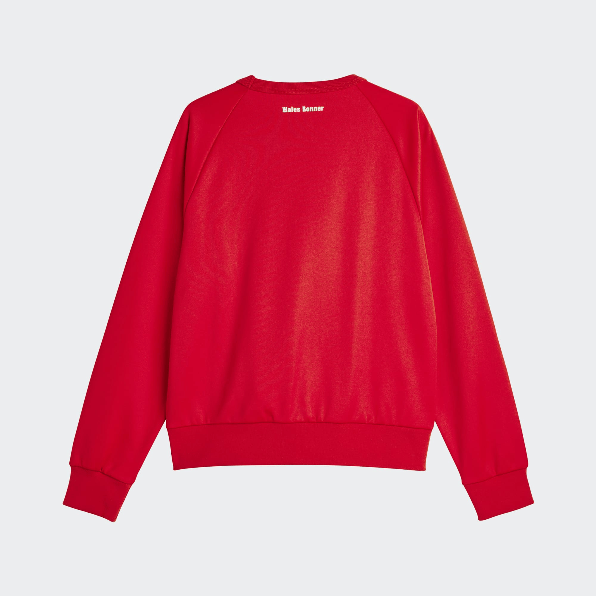 Back view highlighting Wales Bonner logo at the neck with full scarlet body in natural light